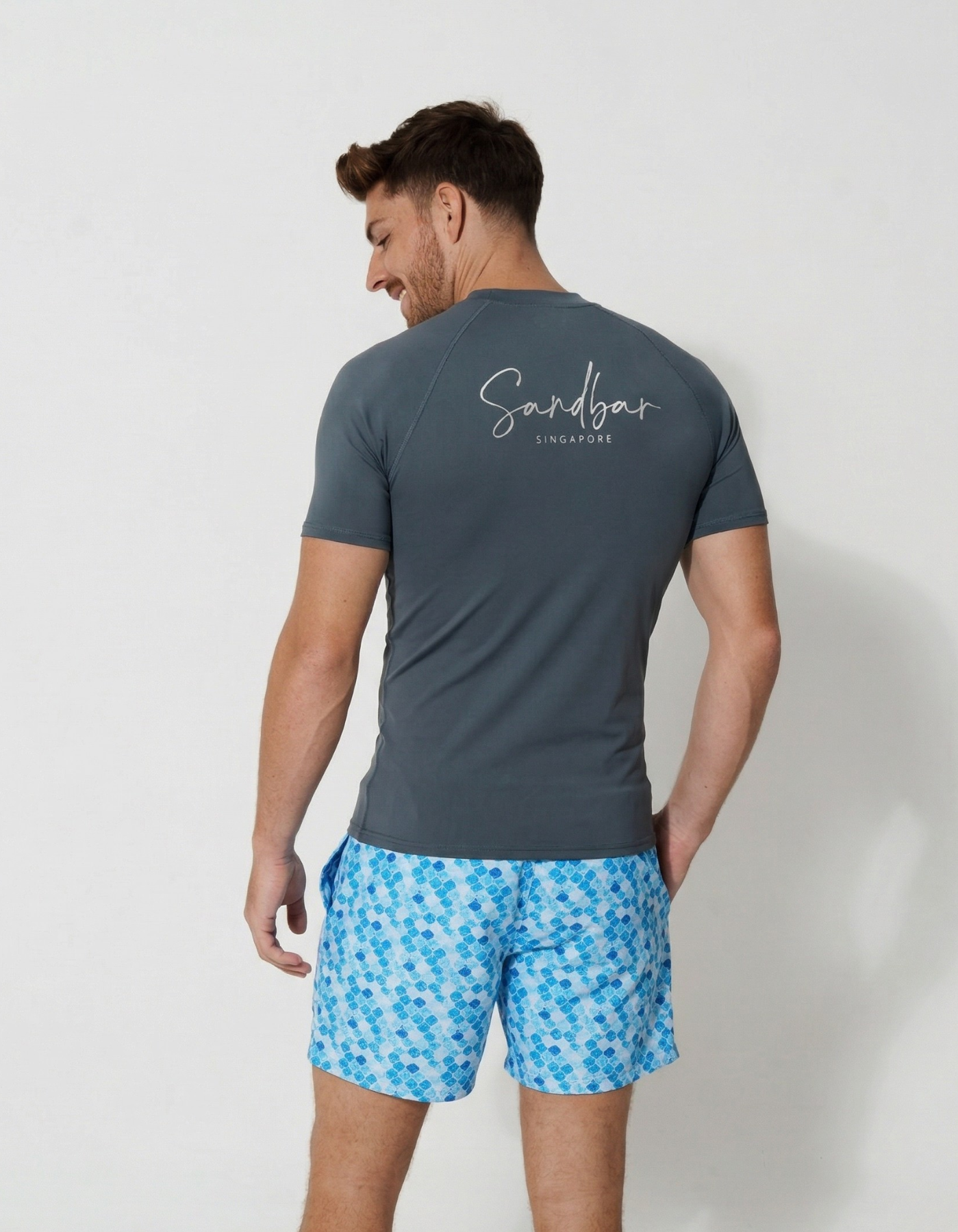 Charcoal Grey Short Sleeved Mens Rash Guard, back view. Mens UPF50 rash guard.