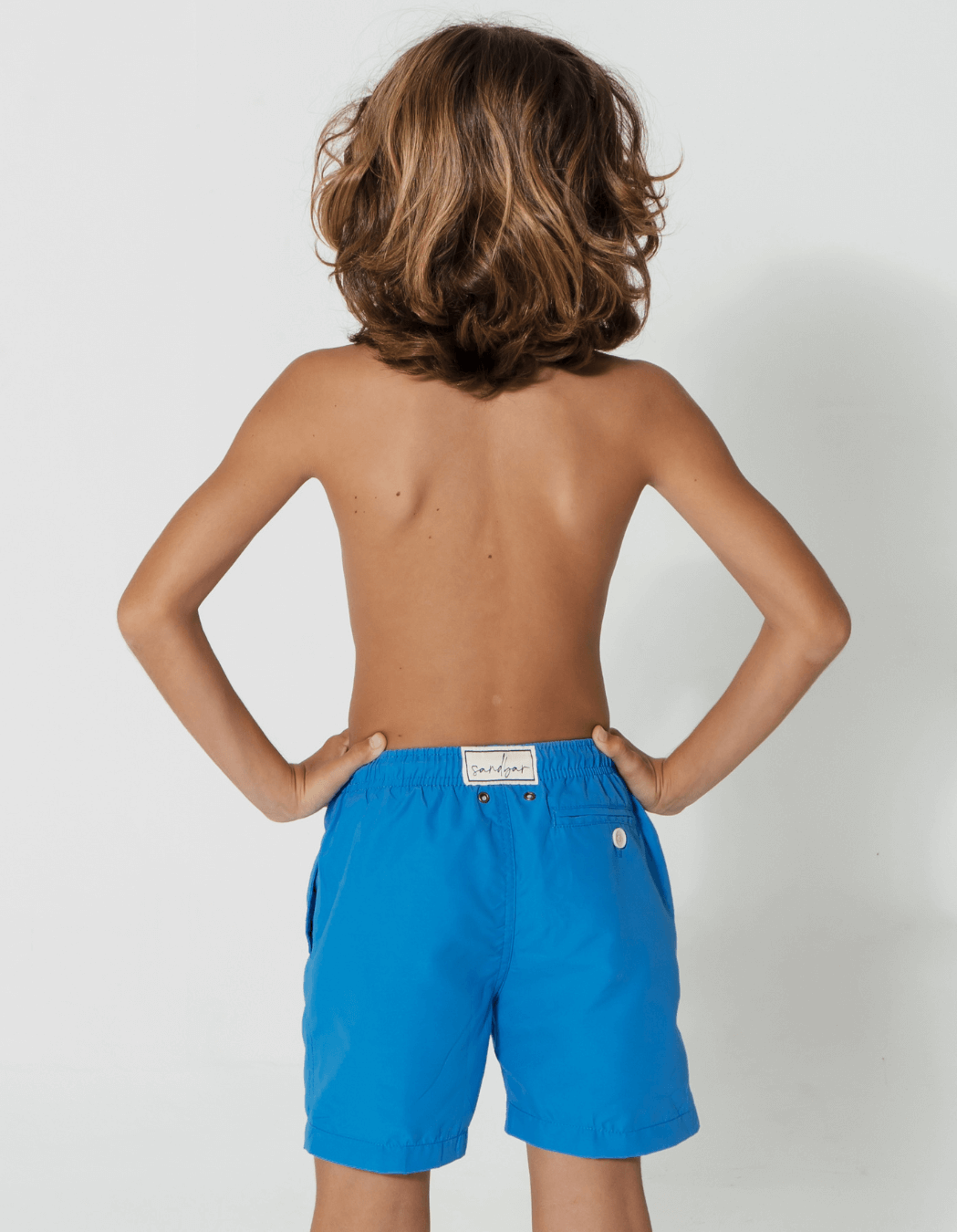 Coastal Blue Boys Swim Shorts, back view. Sustainable boys swimwear.