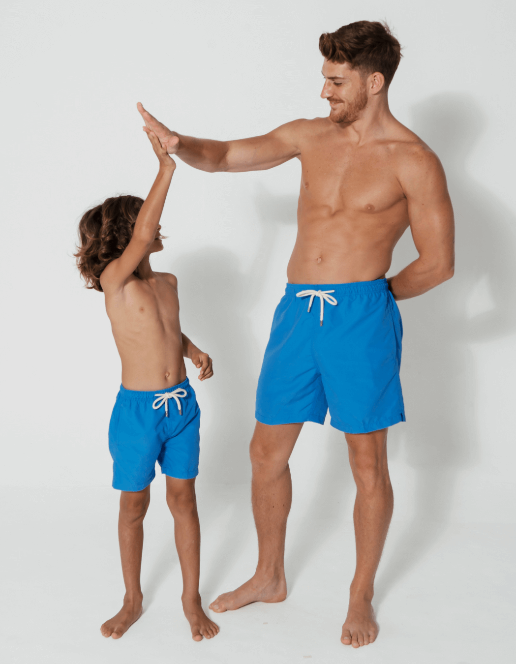 Coastal Blue Mens Swim Shorts, back view. Sustainable mens swimwear.
