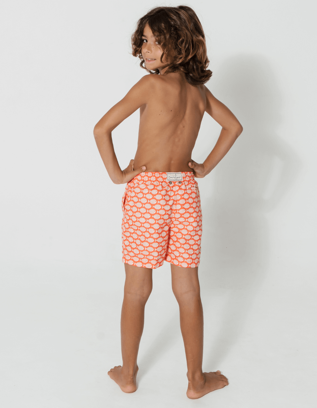 Coral Fish Boys Swim Shorts, back view. Sustainable boys swimwear.