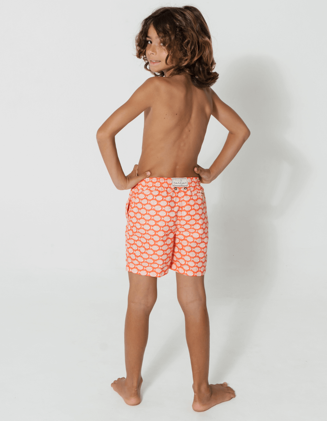 Coral Fish Boys Swim Shorts, back view. Sustainable boys swimwear.