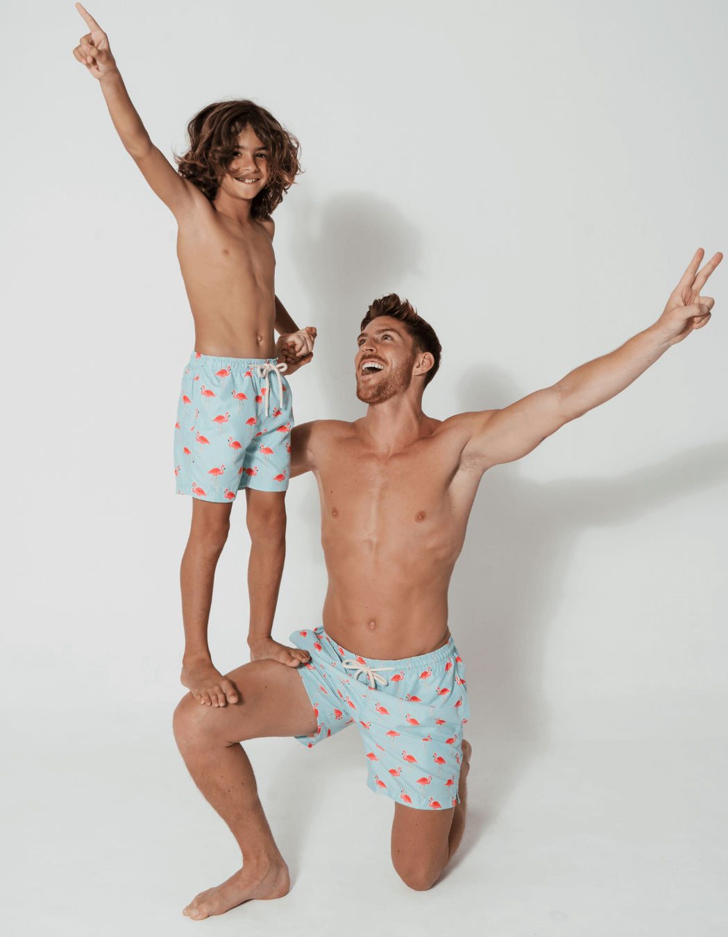 Flamingo Boys Swim Shorts, lifestyle shot. Sustainable boys swimwear.