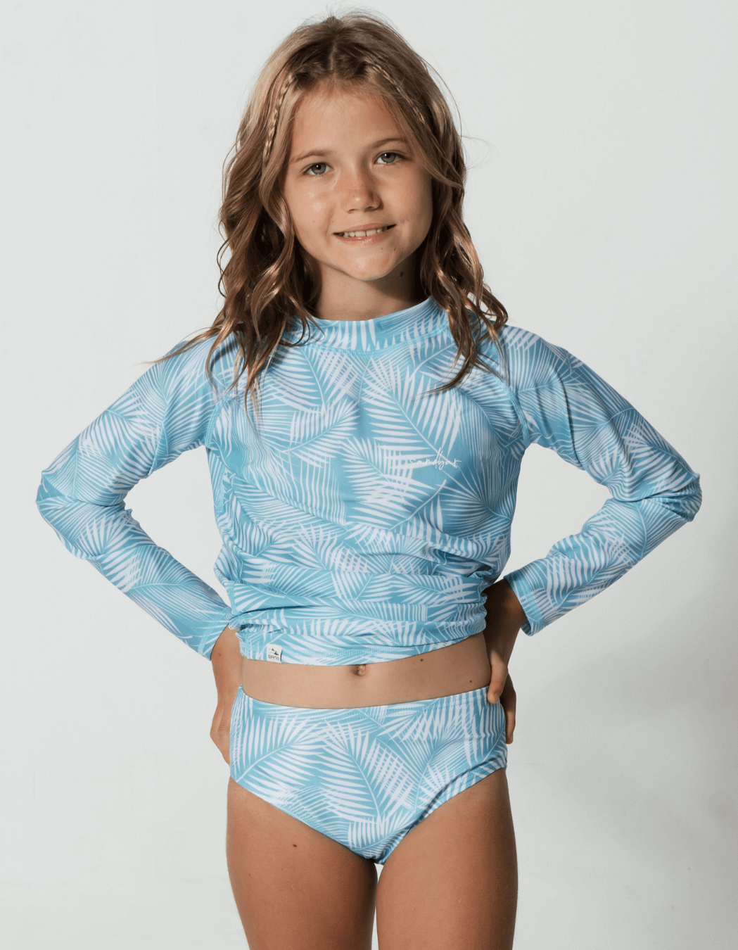 Green Fern Rash Guard, lifestyle shot. Kids UPF50 rash guard.