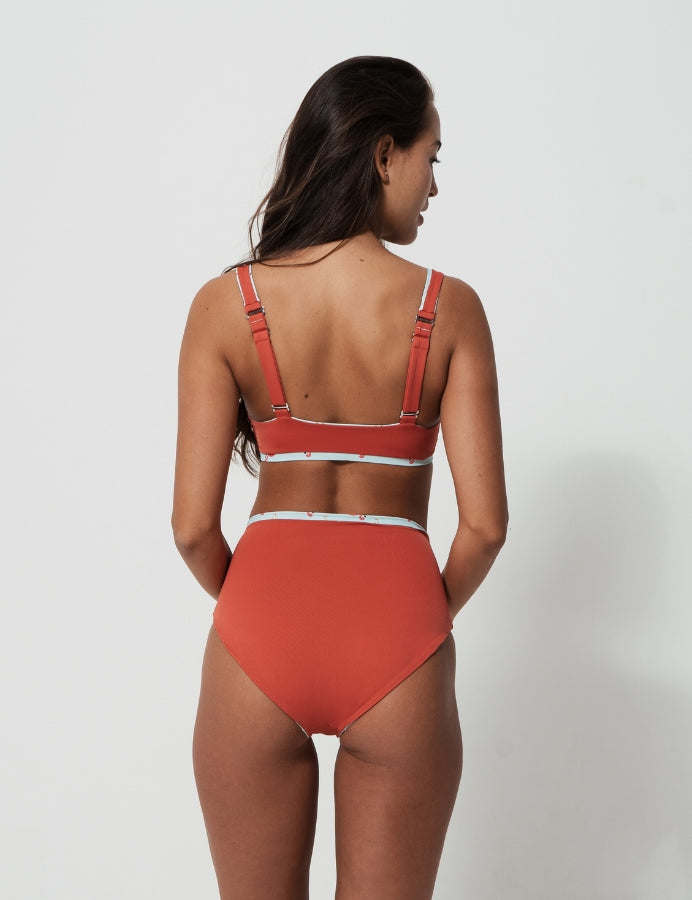 High Waist Pink Flamingo Womens Bikini Bottoms, lifestyle shot. Sustainable womens swimwear.