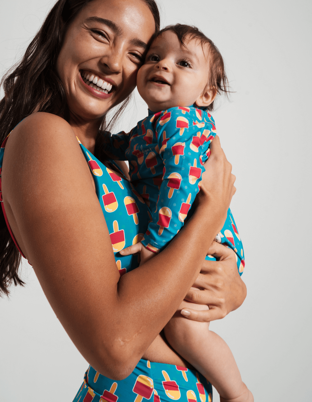 Ice Lolly Baby Swimsuit, lifestyle shot. Sustainable baby swimwear.