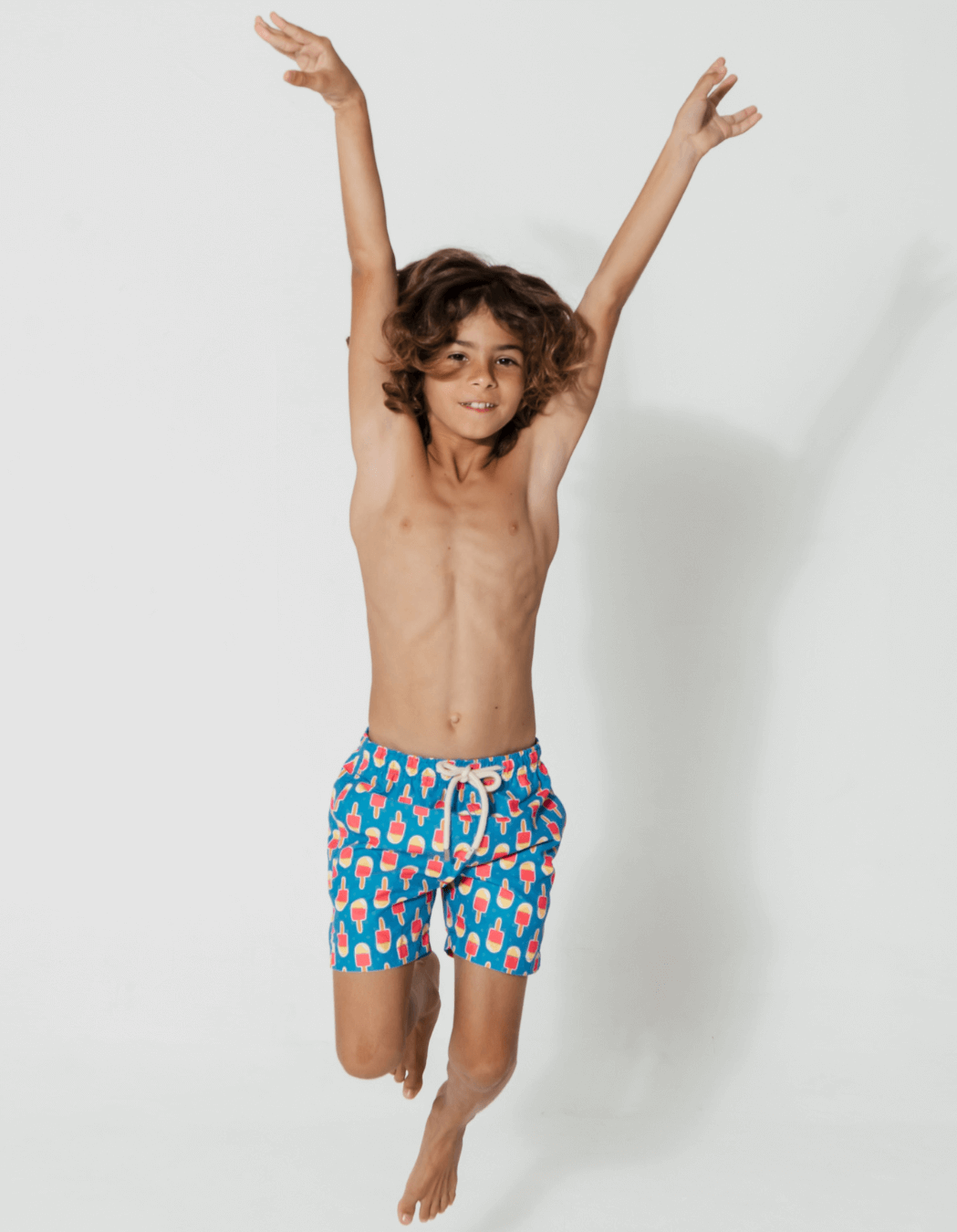 Ice Lolly Boys Swim Shorts, lifestyle shot. Sustainable boys swimwear.