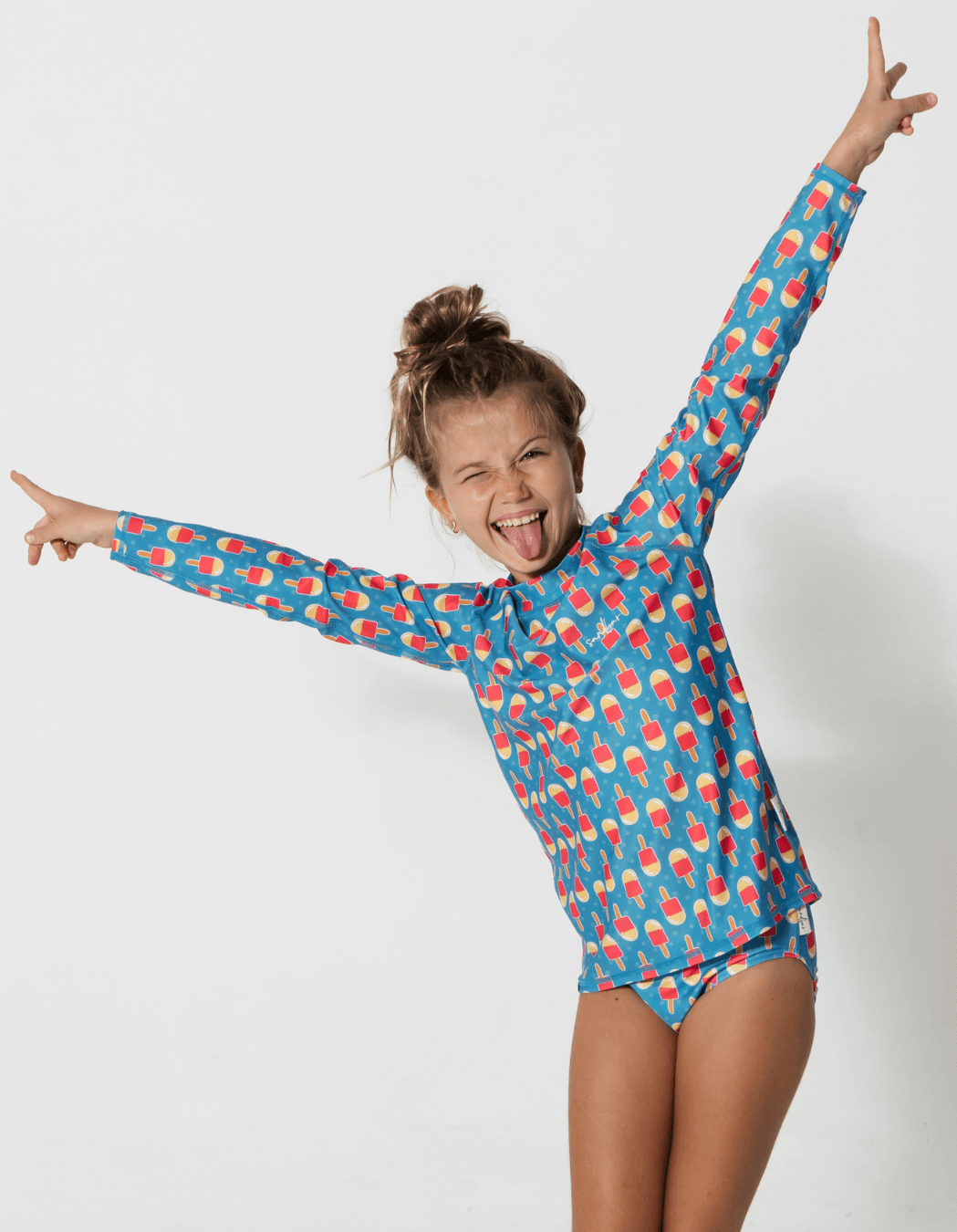 Ice Lolly Rash Guard, lifestyle shot. Kids UPF50 rash guard.