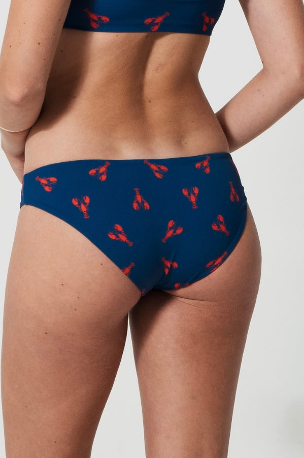 Low Waist Lobster Womens Bikini Bottoms, lifestyle shot. Sustainable womens swimwear.