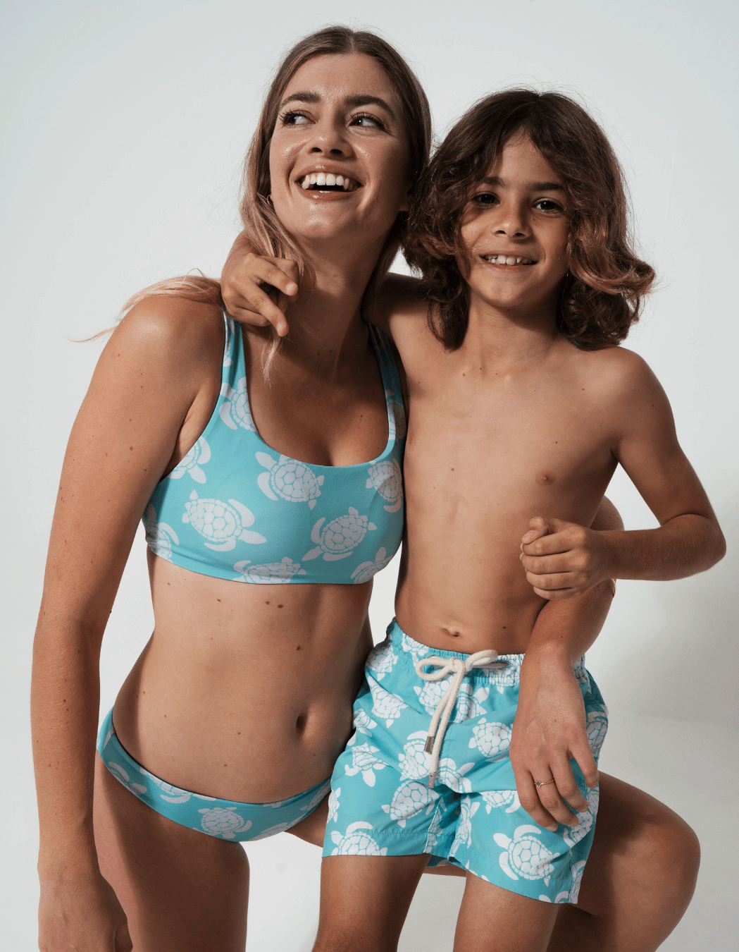 Maldives Blue Turtle Boys Swim Shorts, print detail. Sustainable boys swimwear.