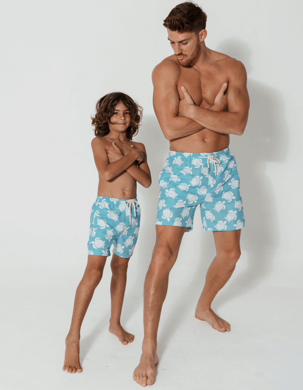 Maldives Blue Turtle Boys Swim Shorts, lifestyle shot. Sustainable boys swimwear.
