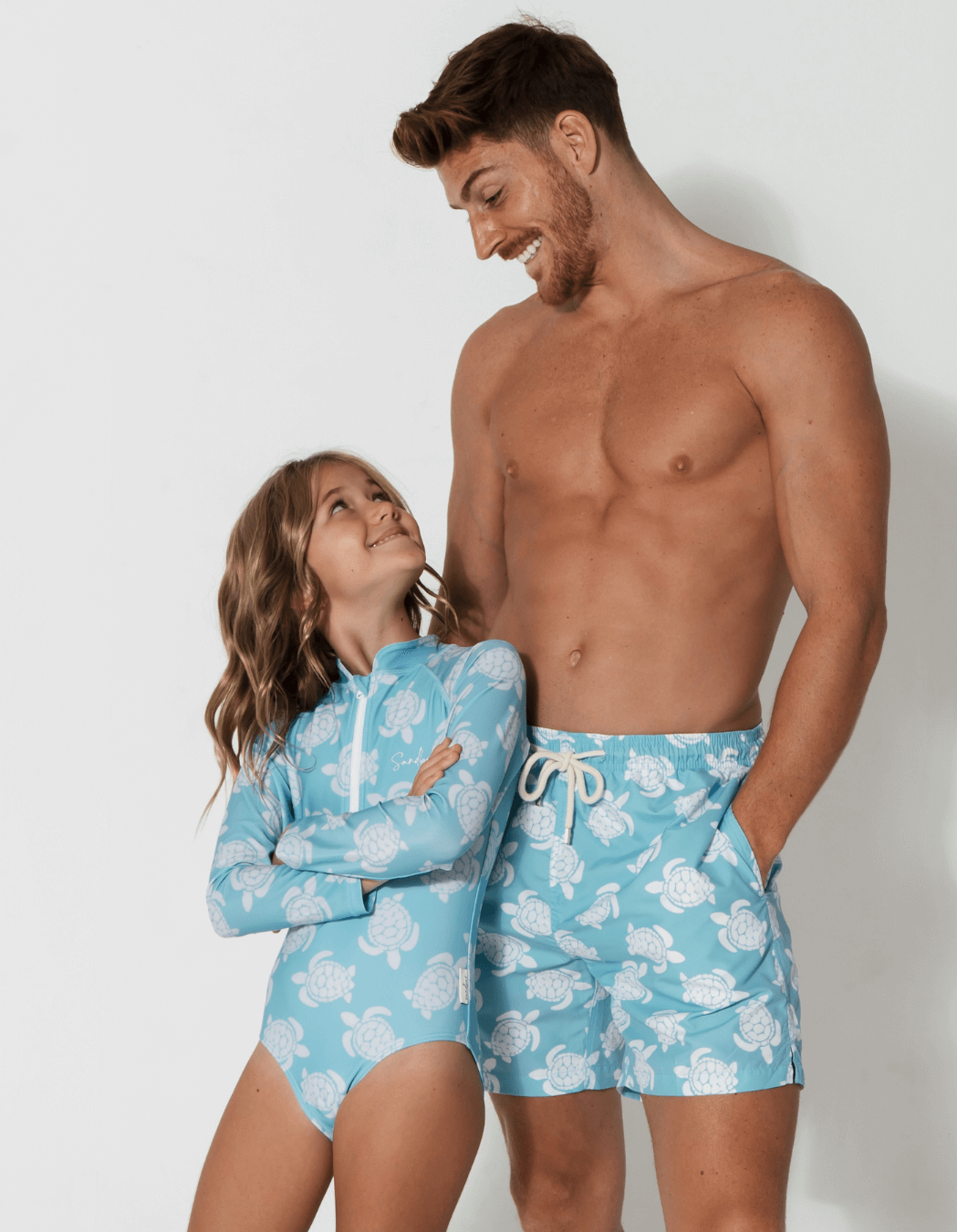 Maldives Blue Turtle Long Sleeved Girls Swimsuit, lifestyle shot. Sustainable girls swimwear.
