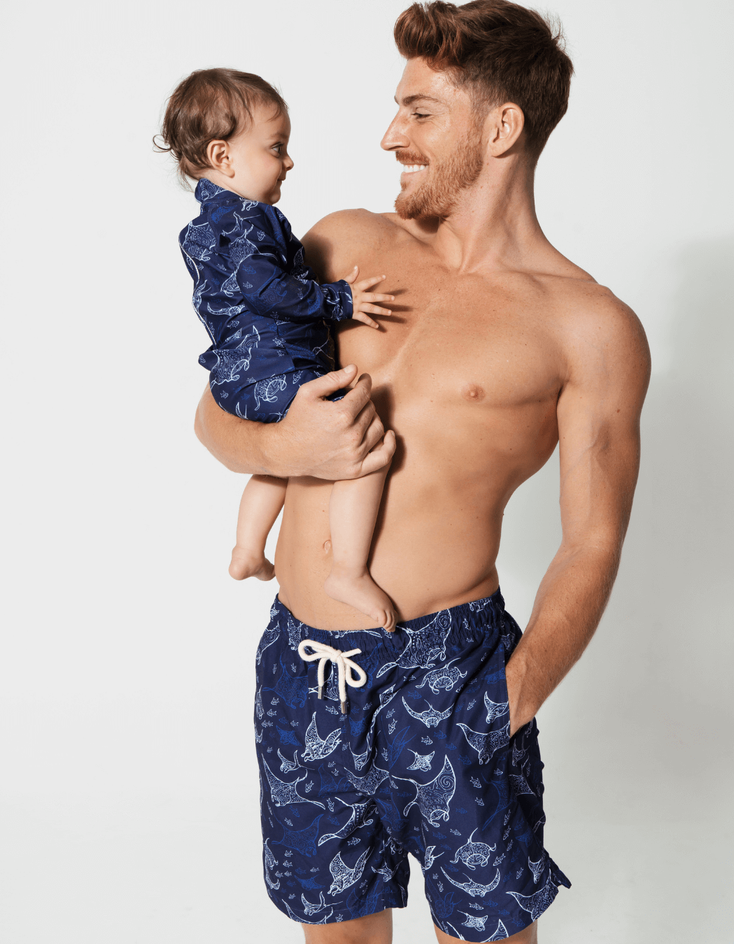 Ocean Manta Baby Swimsuit, lifestyle shot. Sustainable baby swimwear.