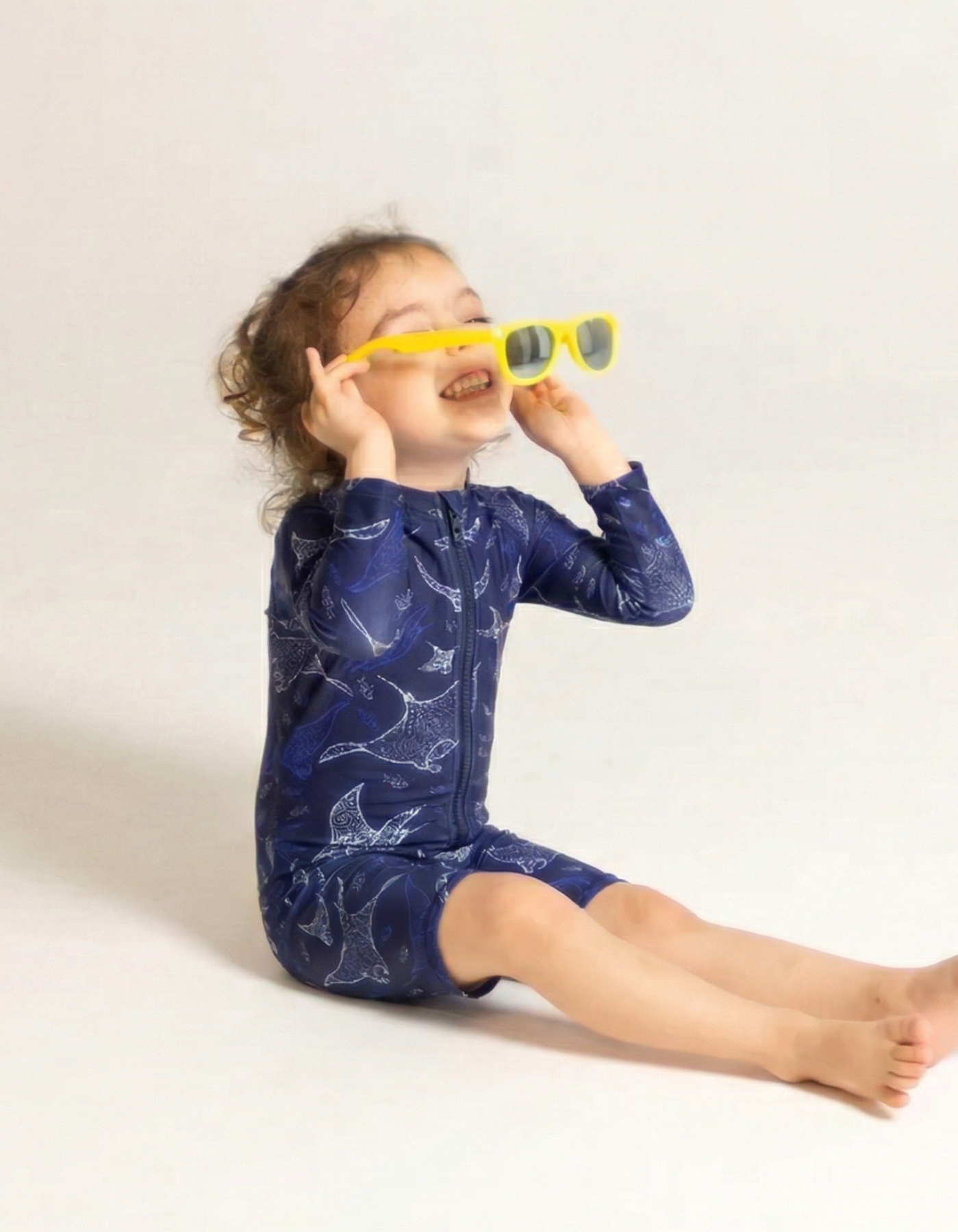 Ocean Manta Kids Body Suit, front view. Sustainable kids swimwear.