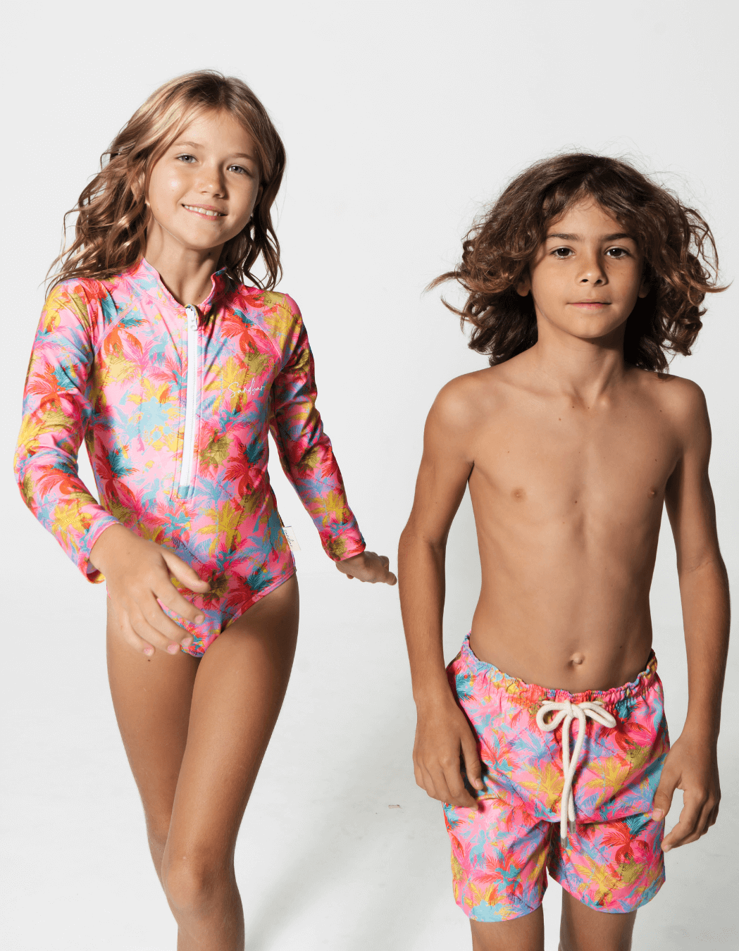 Pink Palm Boys Swim Shorts, additional view. Sustainable boys swimwear.
