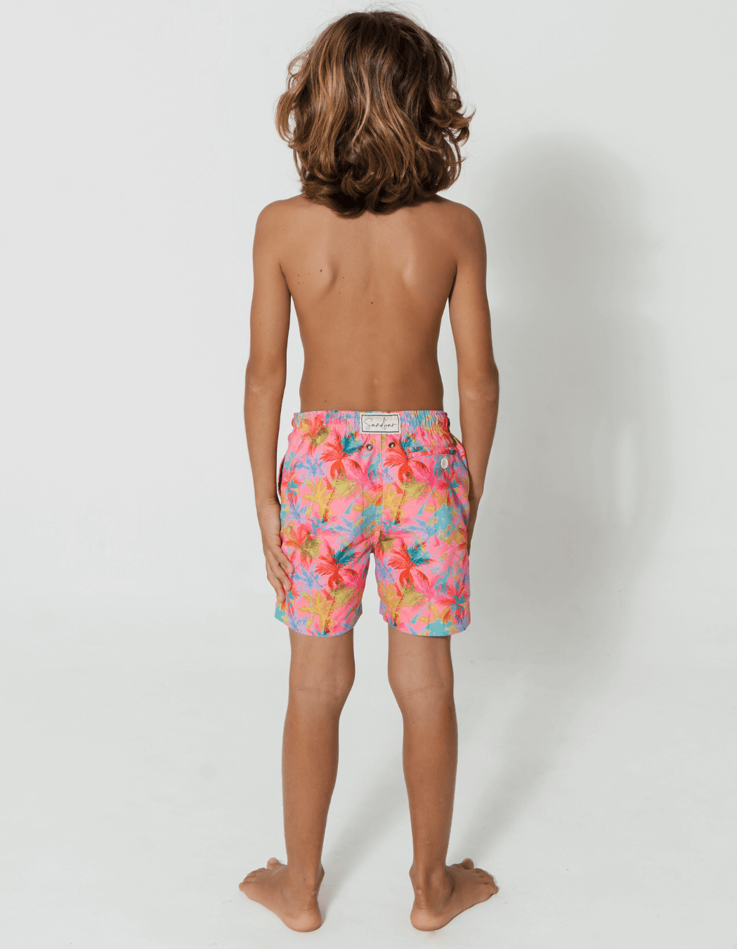 Pink Palm Boys Swim Shorts, additional view. Sustainable boys swimwear.
