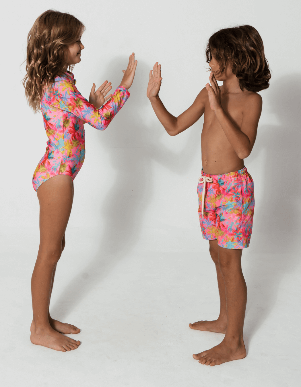 Pink Palm Long Sleeved Girls Swimsuit, additional view. Sustainable girls swimwear.
