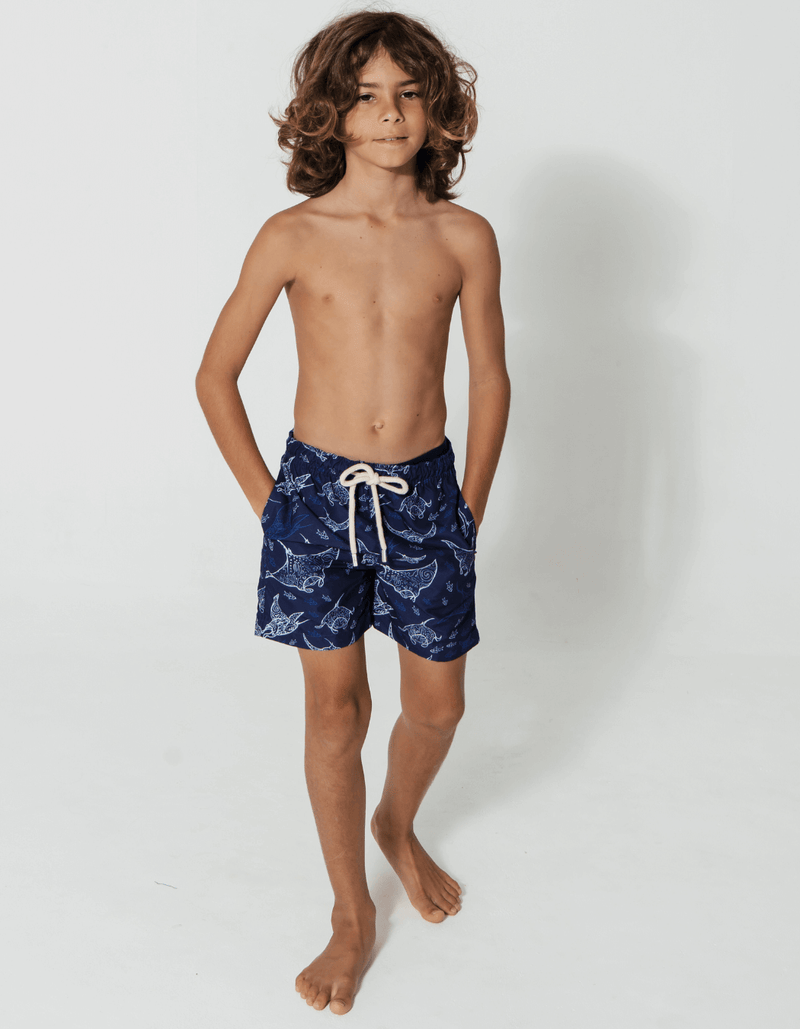Tommy wearing Ocean Manta Boys Swim Shorts, size Age 8