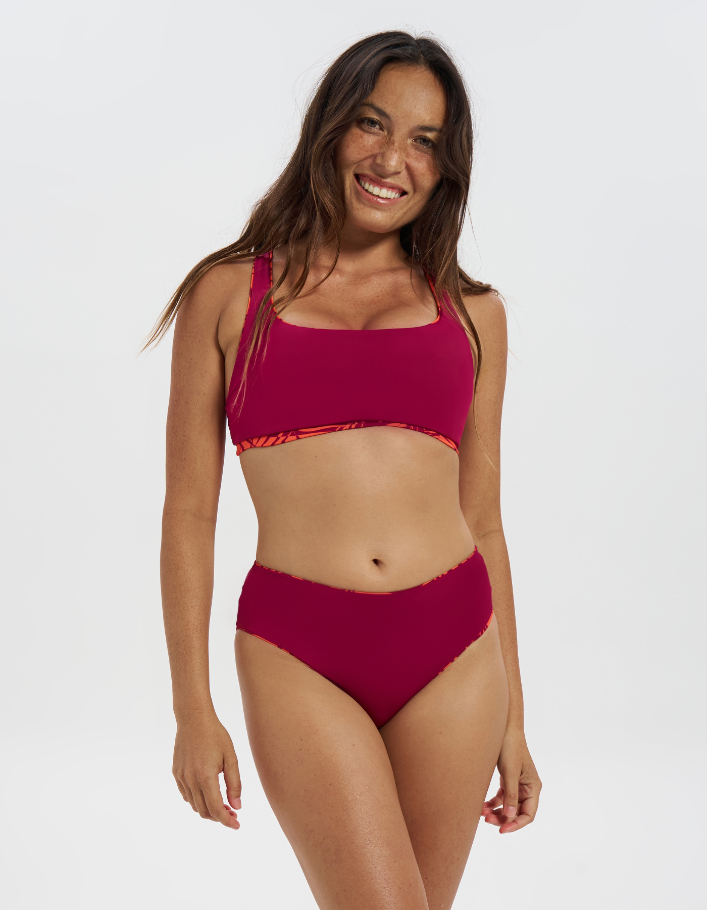 Sunset Palm Womens Tank Bikini Top, lifestyle shot. Sustainable womens swimwear.