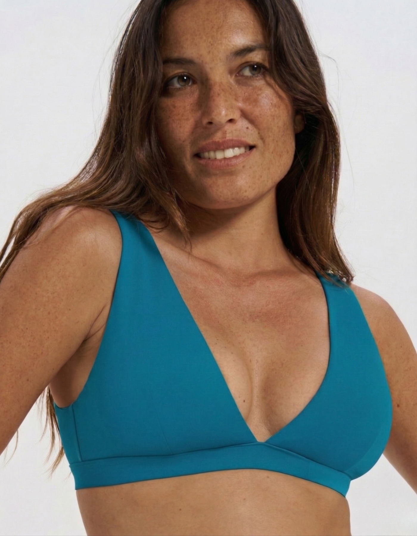 Teal Womens Plunge Bikini Top, front view. Sustainable womens swimwear.