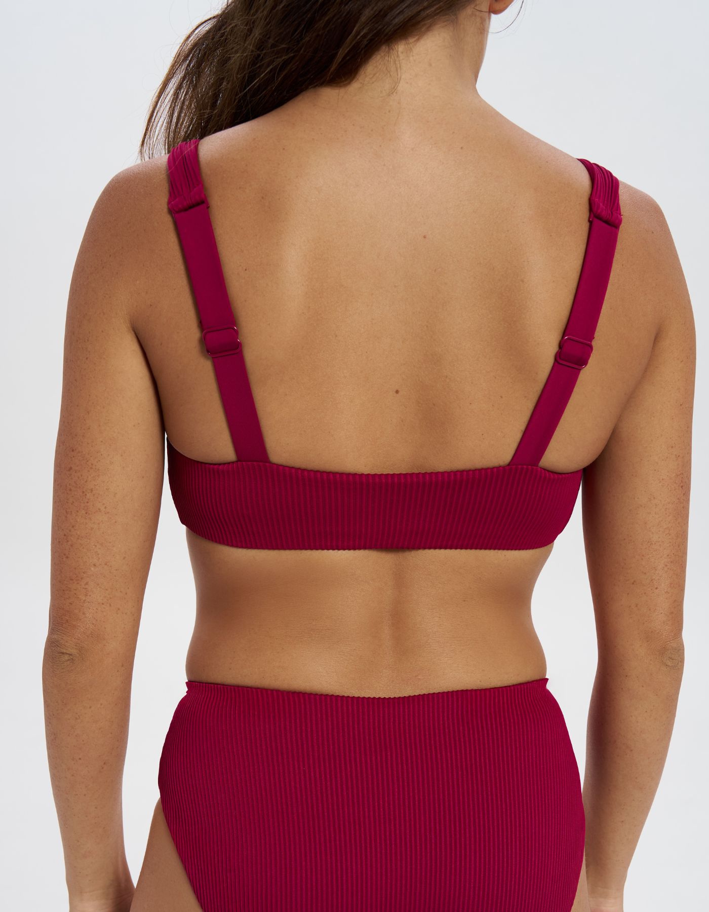Nikoi Plum Womens Ribbed Tank Bikini Top, back view. Sustainable womens swimwear.
