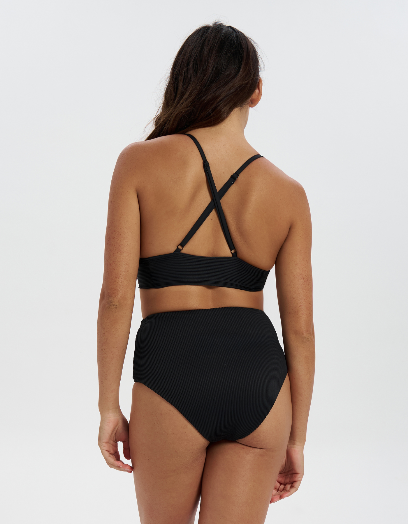 High Waist Black Womens Ribbed Bikini Bottoms, back view. Sustainable womens swimwear.