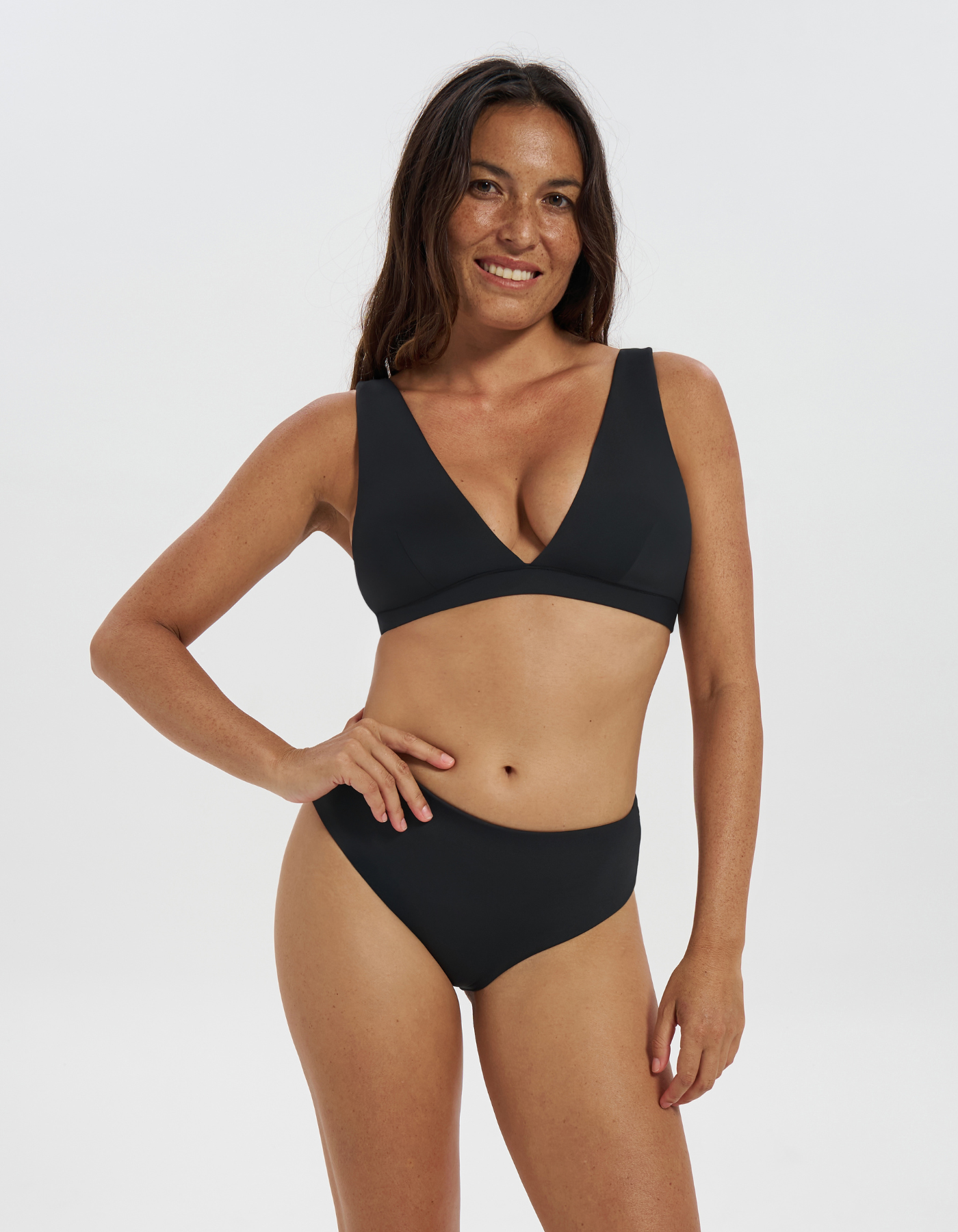 Mid Waist Black Womens Bikini Bottoms, front view. Sustainable womens swimwear.