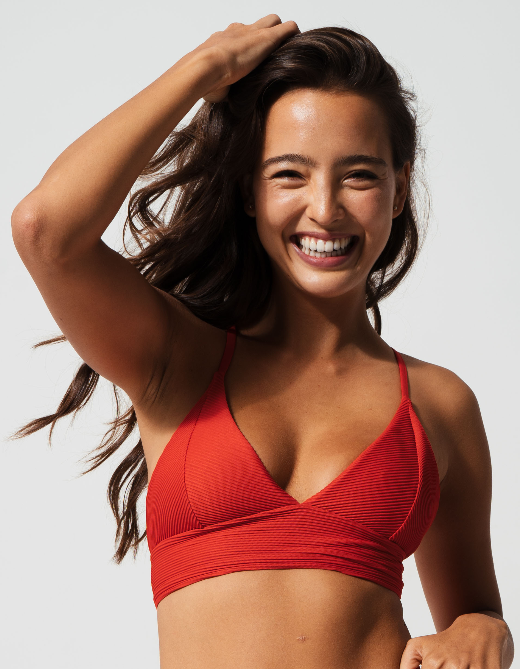 Flores Lipstick Red Womens Ribbed Plunge Bikini Top, front view. Sustainable womens swimwear.