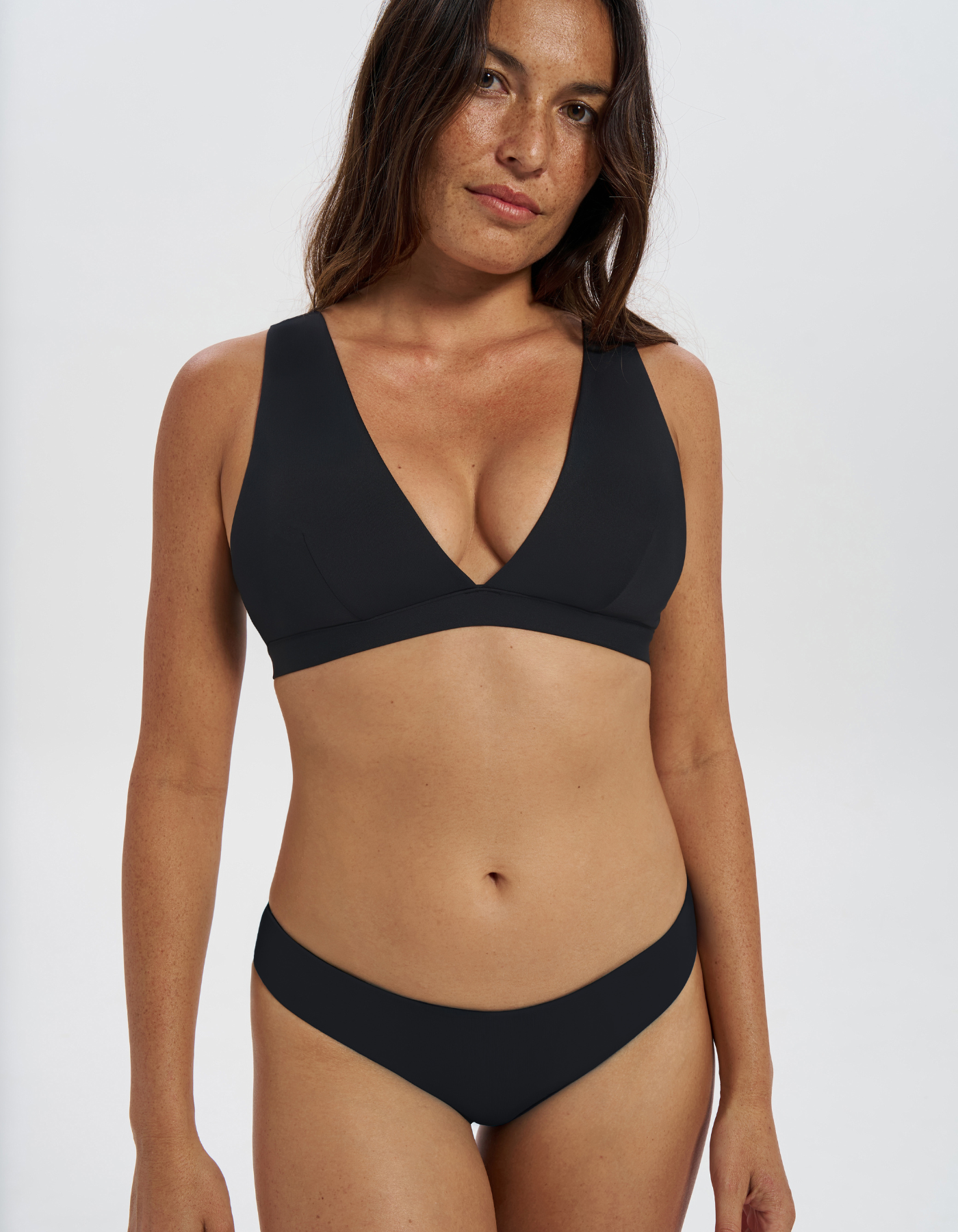 Low Waist Black Womens Bikini Bottoms, front view. Sustainable womens swimwear.