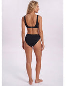 A woman modeling a black two-piece bikini from the back, showing the open back design and high-waisted bottoms, against a plain light background. Sandbar Swimwear
