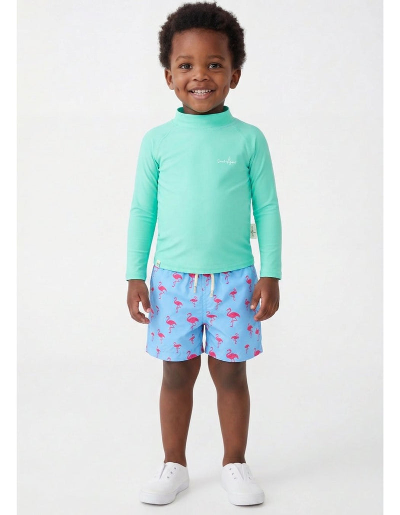 Oscar wearing Embroidered Pink Flamingo Boys Swim Shorts, size Age 3