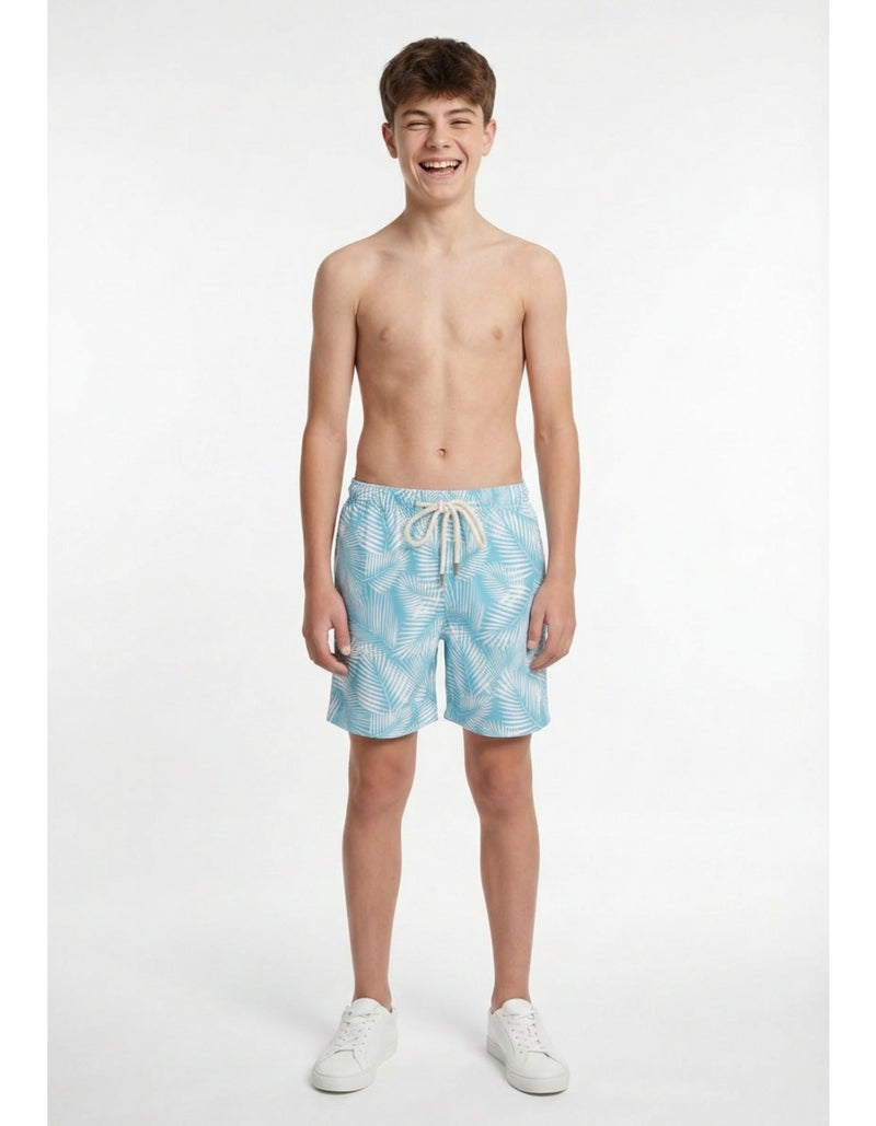 Sam wearing Green Fern Boys Swim Shorts, size Age 13