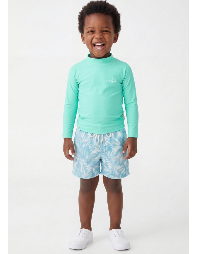 Oscar wearing Green Fern Boys Swim Shorts, size Age 3