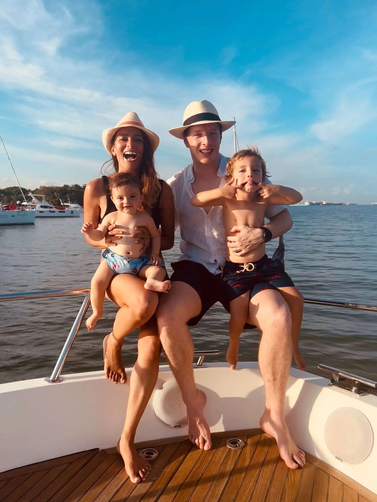 Sandbar founders Mel and Tom with their two children on a boat