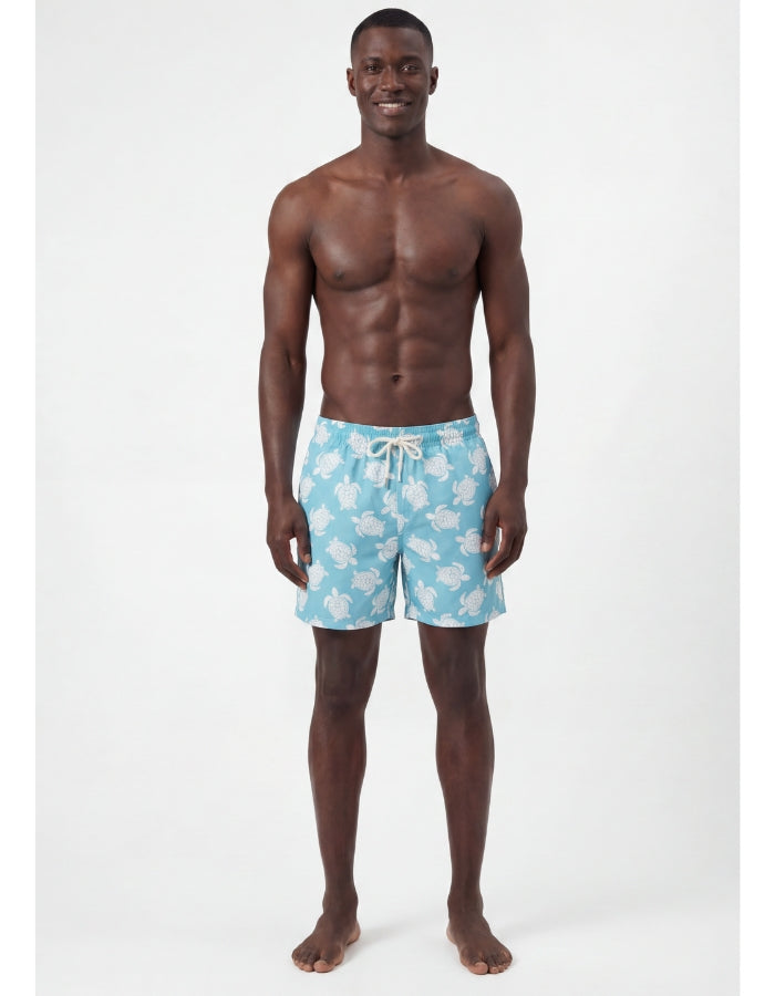 Marcus wearing Maldives Blue Turtle Mens Swim Shorts, size 30 - S