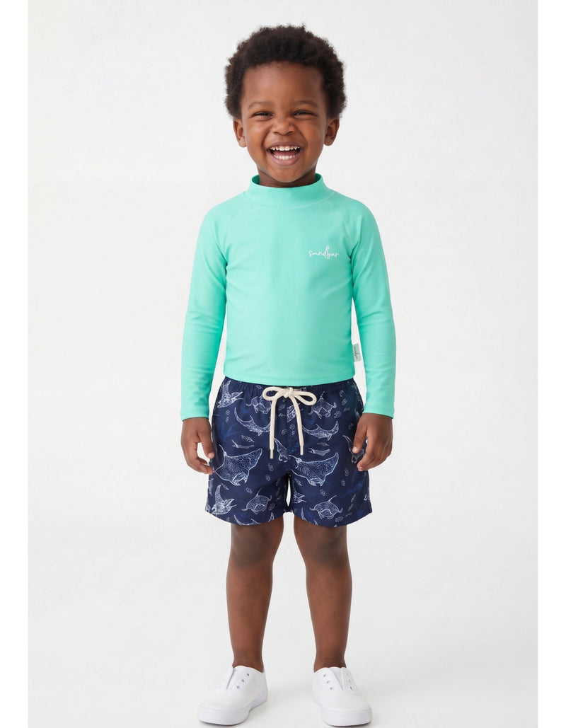 Oscar wearing Ocean Manta Boys Swim Shorts, size Age 3