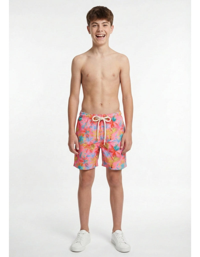 Sam wearing Pink Palm Boys Swim Shorts, size Age 13