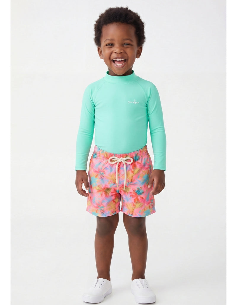 Oscar wearing Pink Palm Boys Swim Shorts, size Age 3