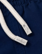 Deep Blue Boys Swim Shorts, mental string end caps. Sustainable boys swimwear.