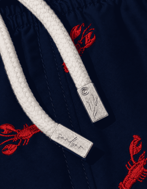 Metal string caps on the Red Lobster swim shorts