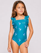 Kids teal hummingbird one-piece swimsuit with ruffle straps, front view, close