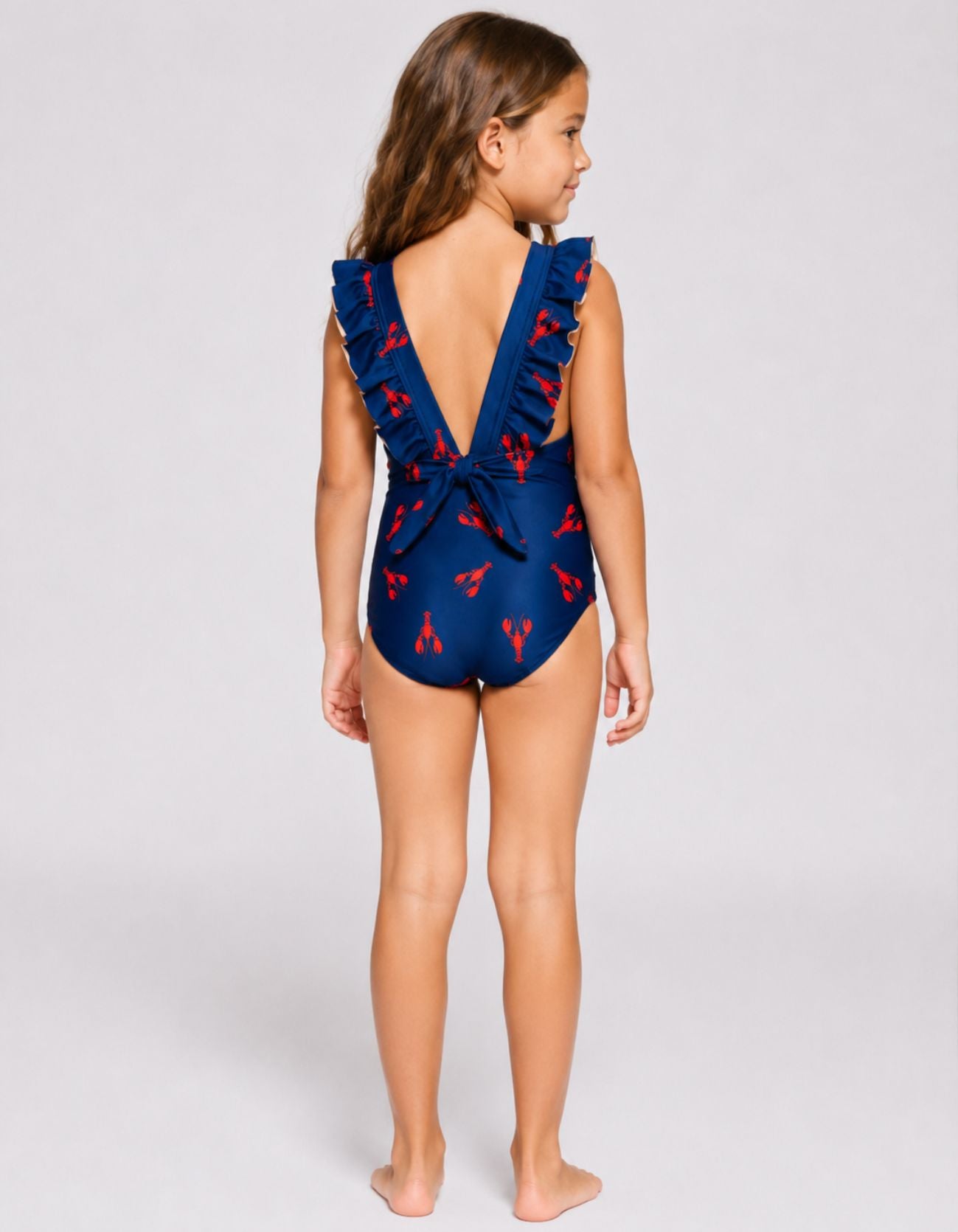 Red Lobster Girls Ruffle Swimsuit, back view. Sustainable girls swimwear.