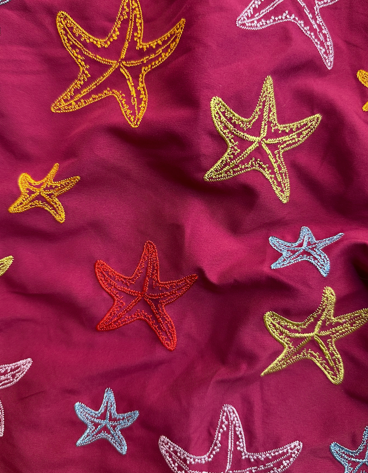 Embroidered Starfish Boys Swim Shorts, back view. Embroidered kids swim shorts.
