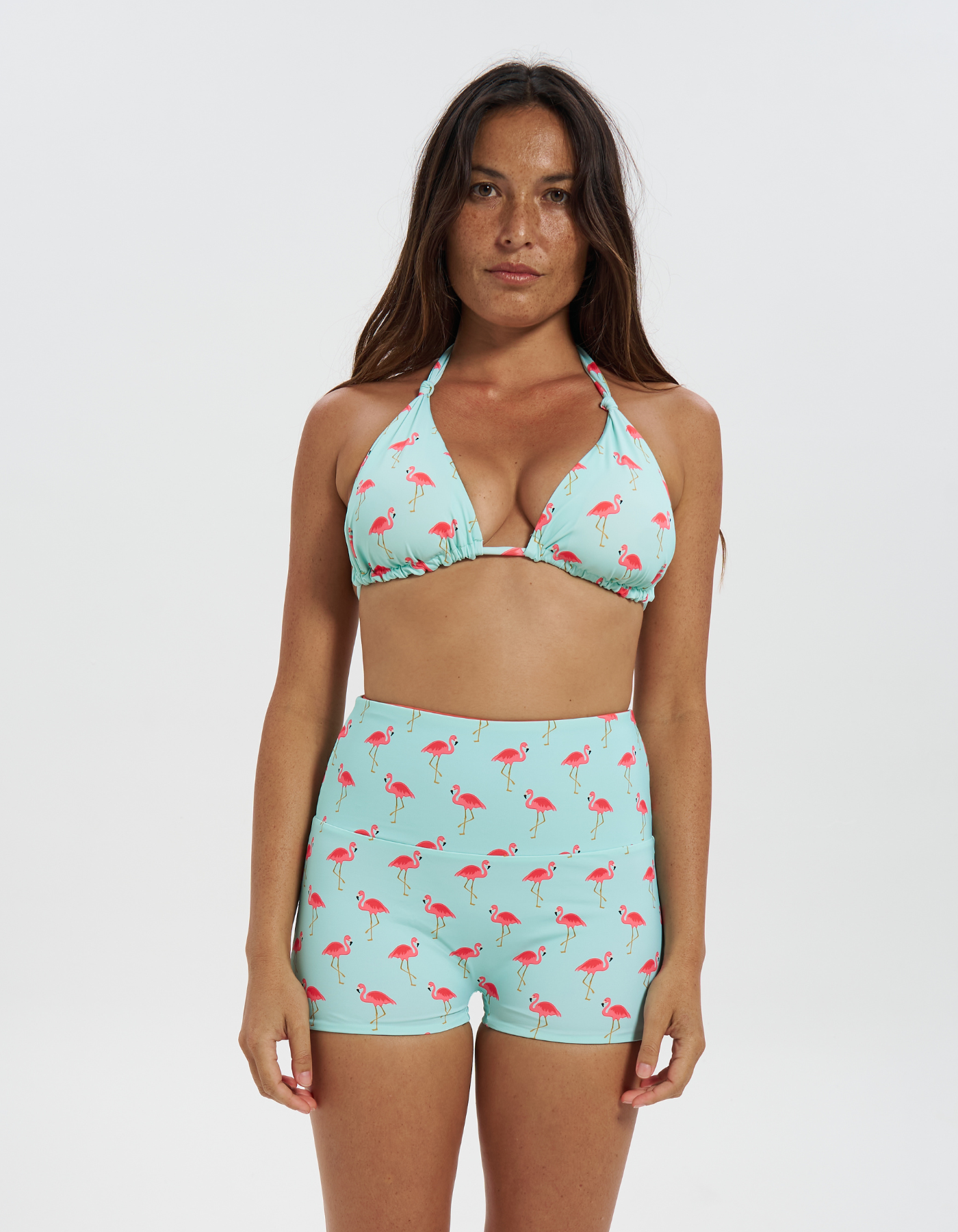 Pink Flamingo / Coral Womens Reversible Swim Shorts, front view. Sustainable womens swimwear.