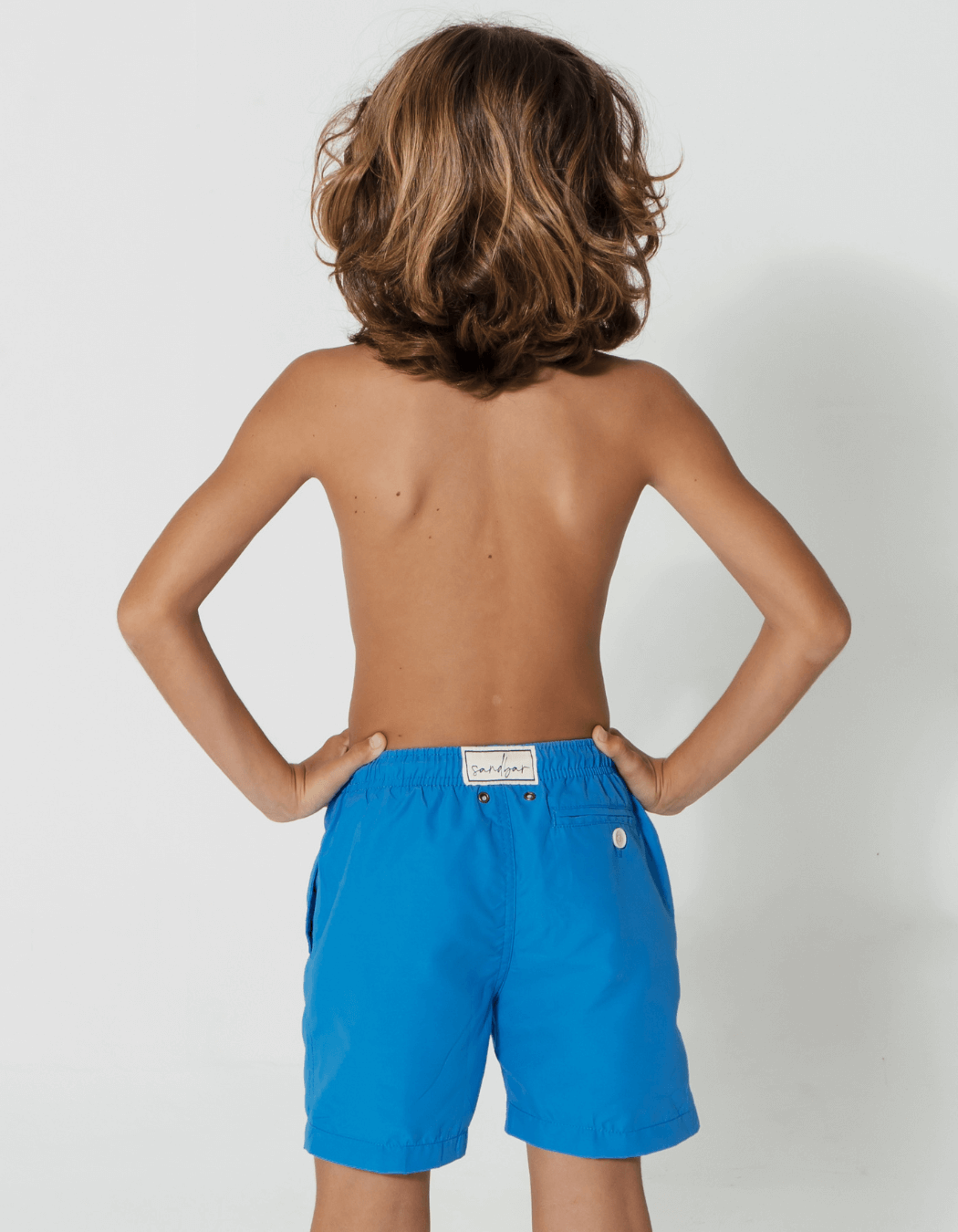 Coastal Blue Boys Swim Shorts, back view. Sustainable boys swimwear.