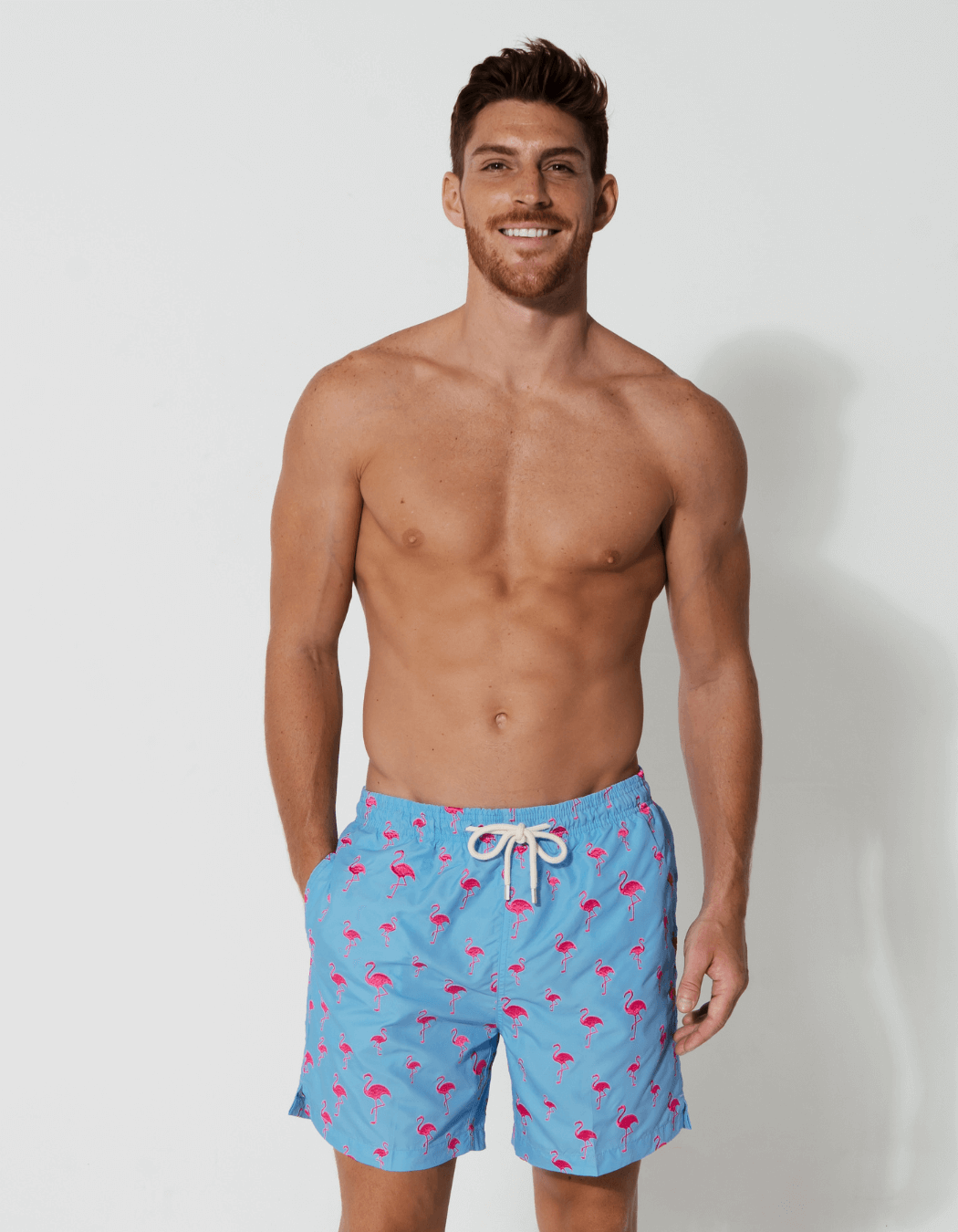 Pink flamingo swimming trunks discount